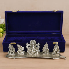 Instrument playing 5 ganesha idol on a leaf