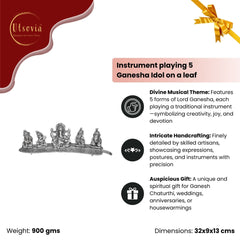 Instrument playing 5 ganesha idol on a leaf