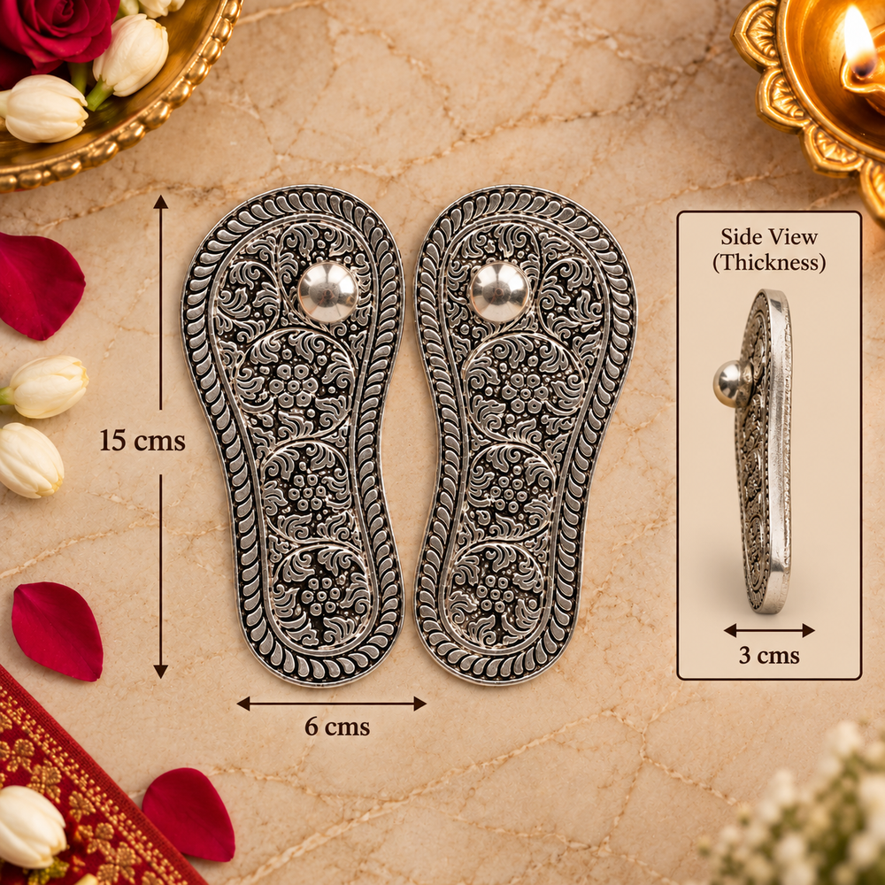 A pair of ornate silver-toned metal shoe insoles with detailed floral engravings and a central round stud, shown on a beige textured background with decorative flowers and a side view inset. Measurement labels indicate 15 cm height, 6 cm width, and 3 cm side thickness.