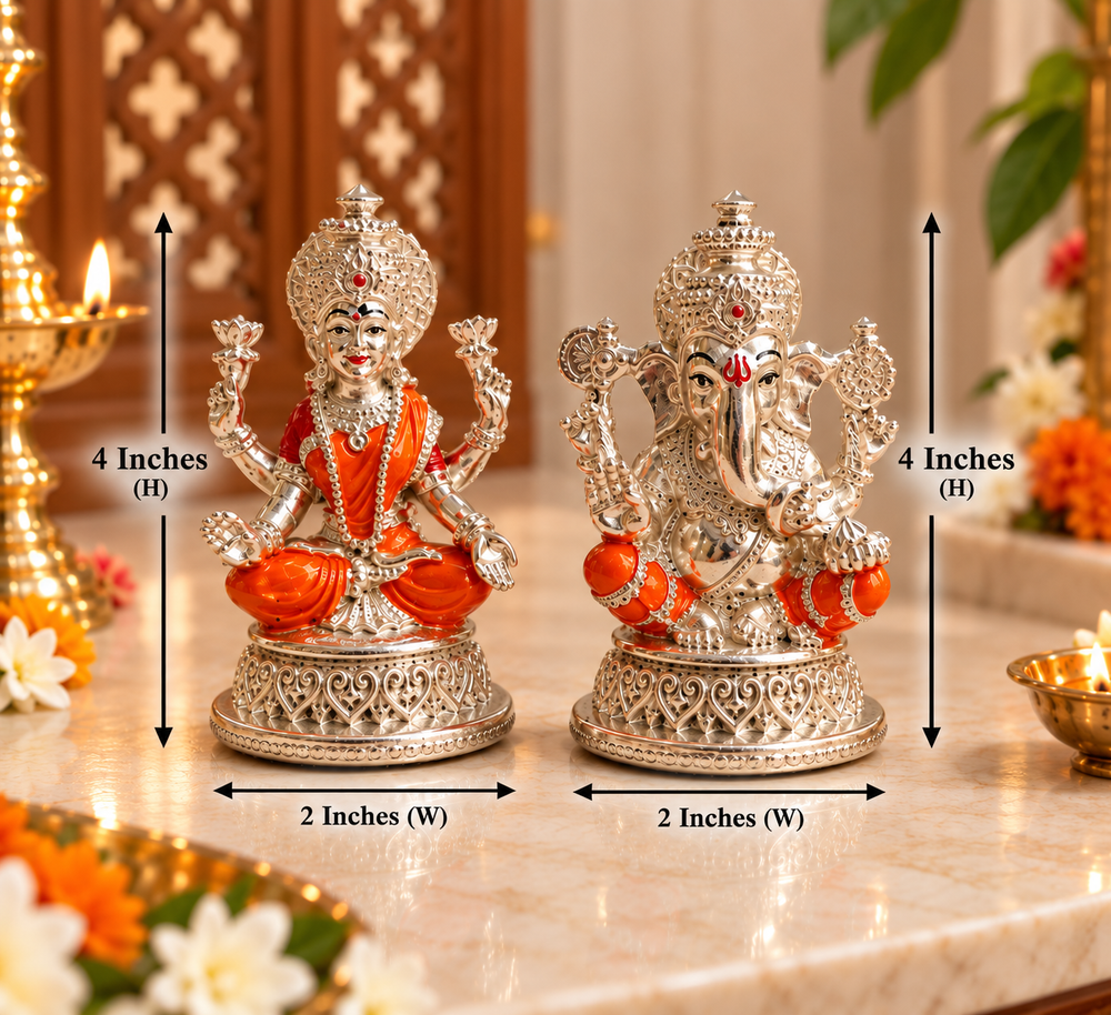 Two ornate silver deity figurines on a marble surface with overlaid dimension arrows and text showing 4 inches height and 2 inches width. The left figurine is seated in orange robes, and the right figurine is more detailed in silver with small orange accents.