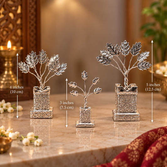 Three silver decorative tree ornaments in different sizes displayed on a marble surface with dimension arrows and text indicating 4 inches, 3 inches, and 5 inches.