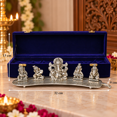 Silver-toned Ganesha idol set displayed in front of an open royal blue presentation box on a marble surface, with overlaid dimension markers showing 32 cm length, 9 cm width, and 13 cm height.
