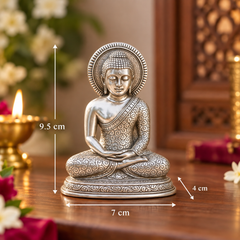 A silver-toned seated Buddha figurine on a wooden table, with overlaid dimension arrows and labels showing 9.5 cm height, 7 cm width, and 4 cm base depth.