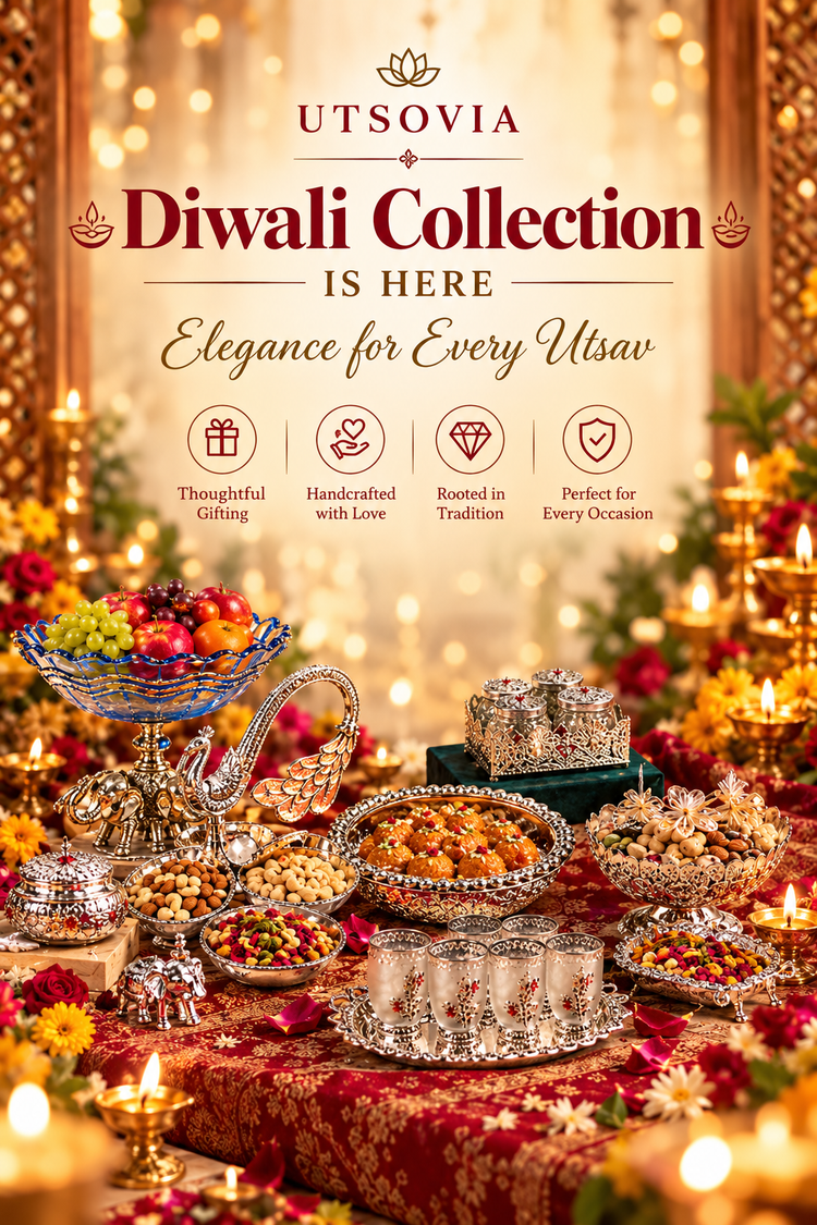 Promotional banner for UTSOVIA Diwali Collection, showcasing an elaborate festive spread with silver bowls, candles, and packaged gift boxes on a richly decorated table, set against a warm golden bokeh background with the text 'UTSOVIA Diwali Collection IS HERE Elegance for Every Utsav'.