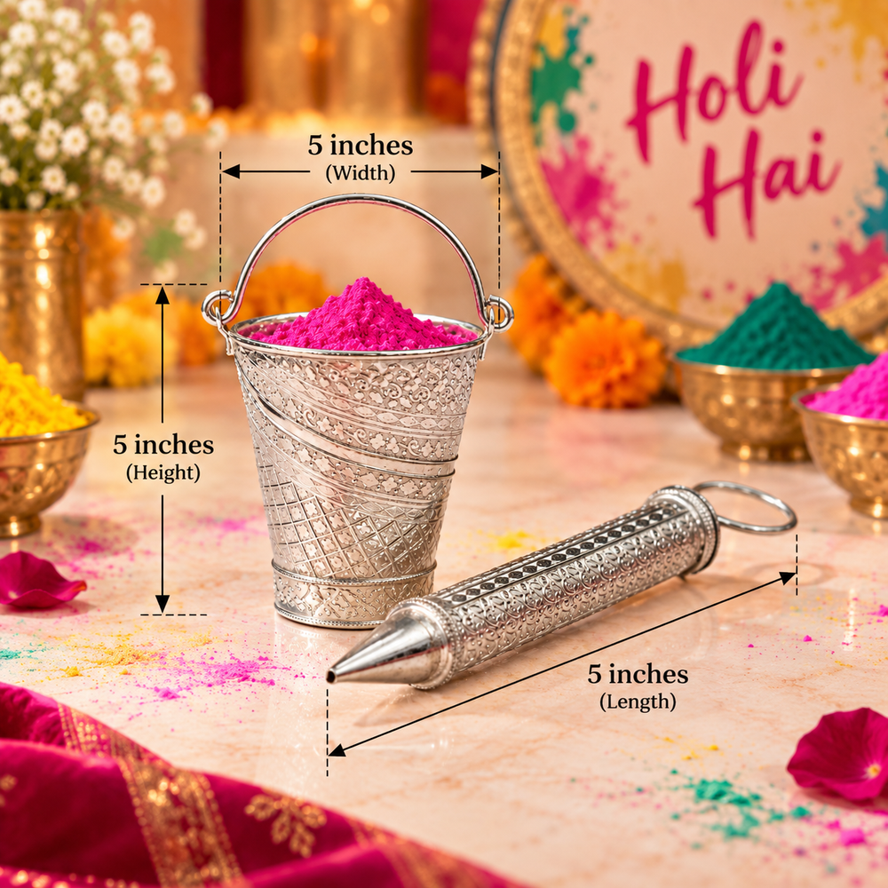 A silver metal Holi powder dispenser set shown with dimension callouts. The set includes a small decorated bucket filled with bright pink Holi powder and a matching cylindrical dispenser lying beside it.