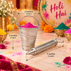 A silver metal Holi powder dispenser set shown with dimension callouts. The set includes a small decorated bucket filled with bright pink Holi powder and a matching cylindrical dispenser lying beside it.