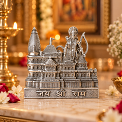 A detailed silver-toned metal miniature sculpture of Shri Ram and the Harmandir Sahib temple, featuring the inscription 'Jai Shree Ram' on the base, displayed on a marble surface with a warm, blurred background.