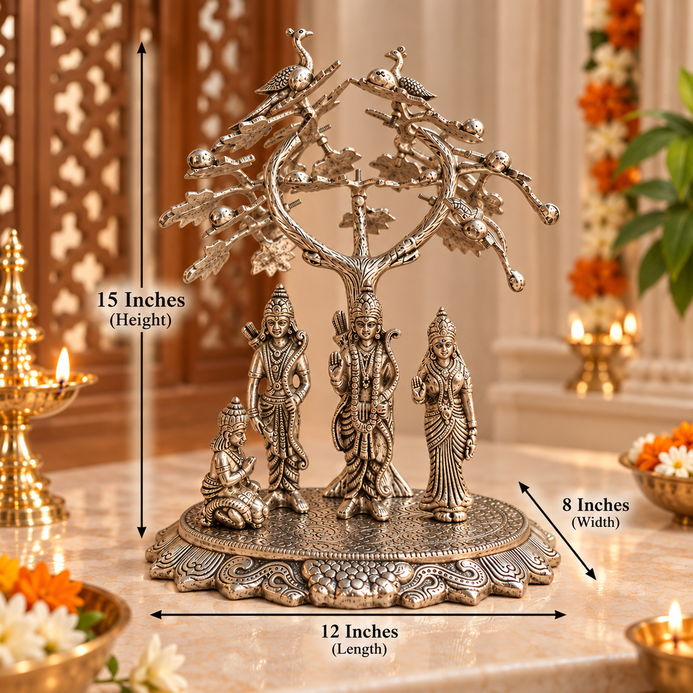 Silver-toned Hindu deity family tree statue on a decorative pedestal base, shown with dimension callouts indicating 15 inches height, 12 inches length, and 8 inches width. The scene is a styled indoor setting with lit candles and floral decor in the background.